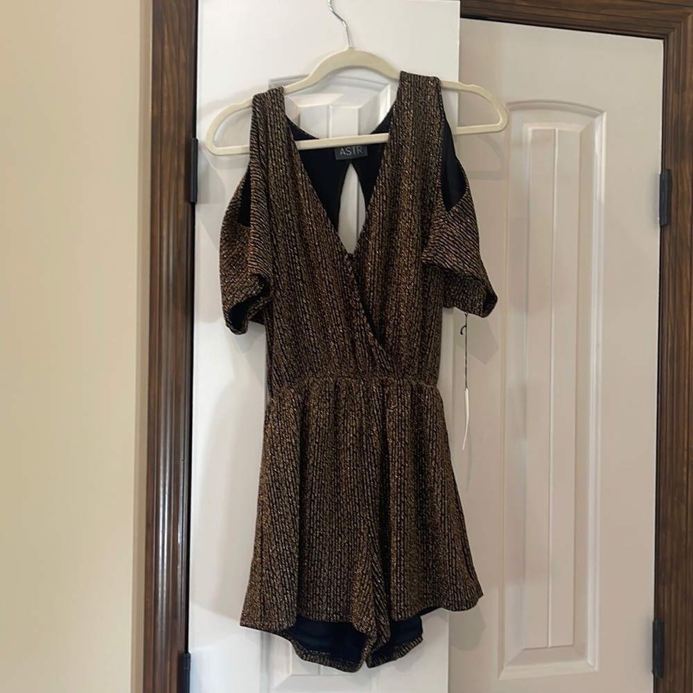 Romper with cut out shoulders and peep hole in the back